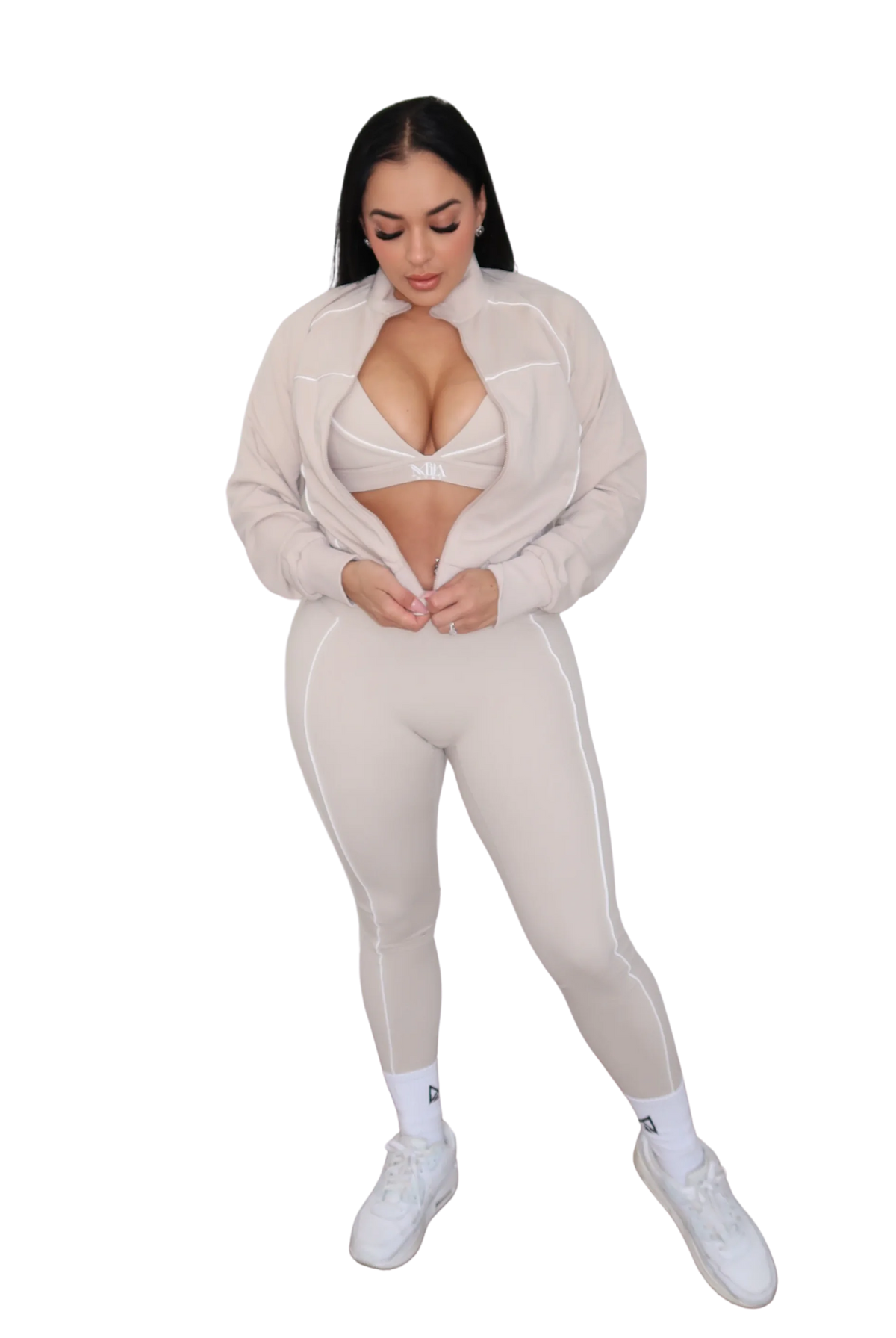 Full body view of woman wearing a beige jacket