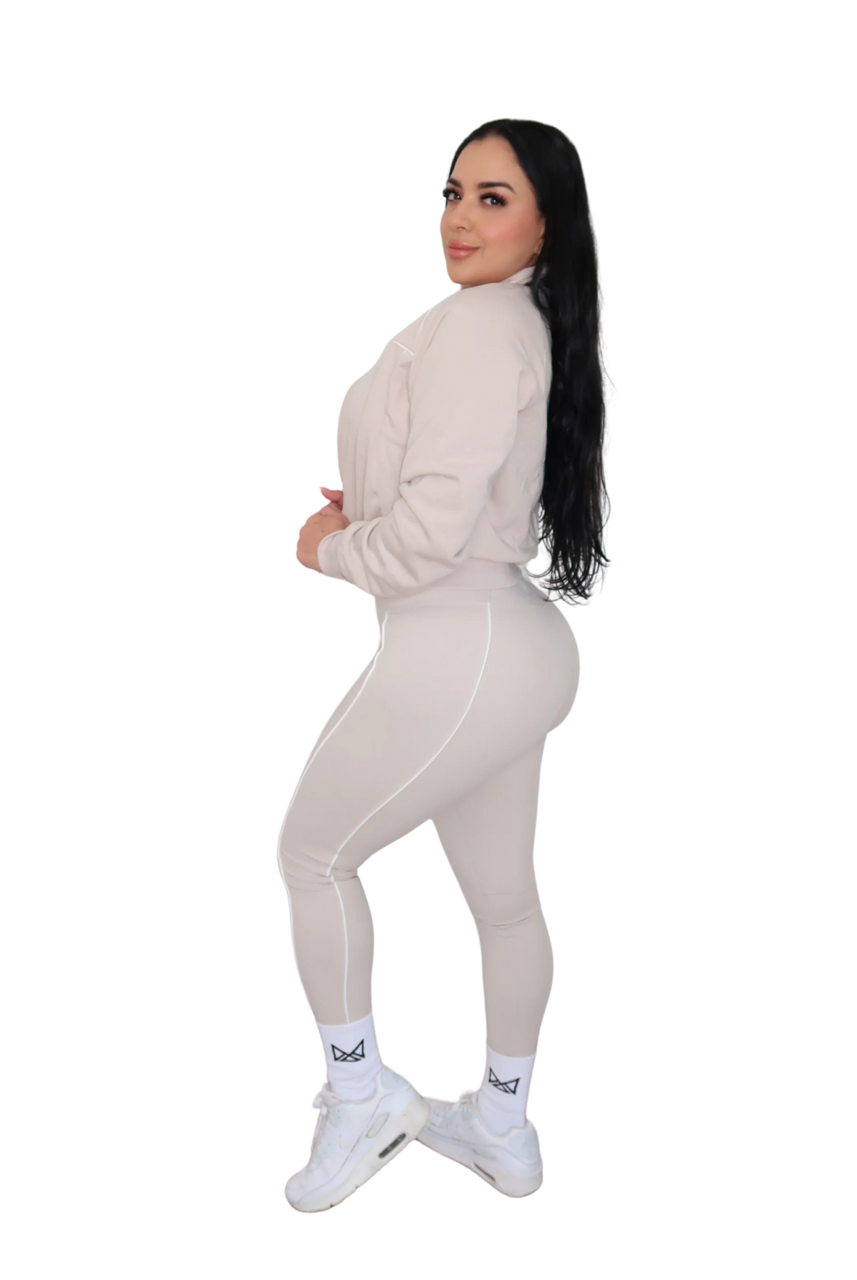 Side view of woman wearing a beige jacket, full body