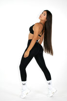 MILA MVMT Athletic Sportswear Aria Sports Bra & Buttery Soft Leggings & Shorts Gym Set Black Strappy Back Side View