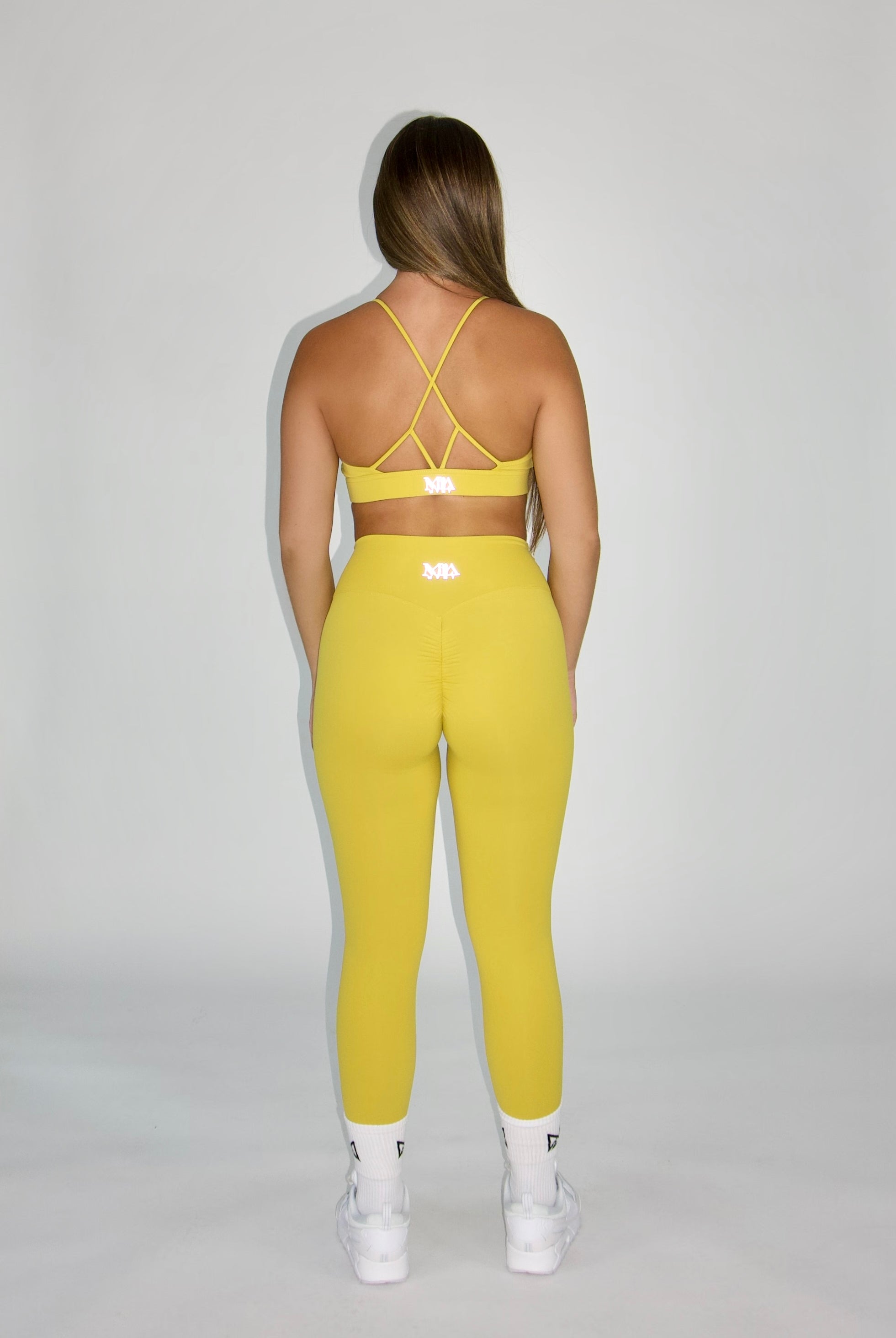 MILA MVMT Sportswear Emmie Sports Bra & Emmie Leggings Mustard Yellow - back view