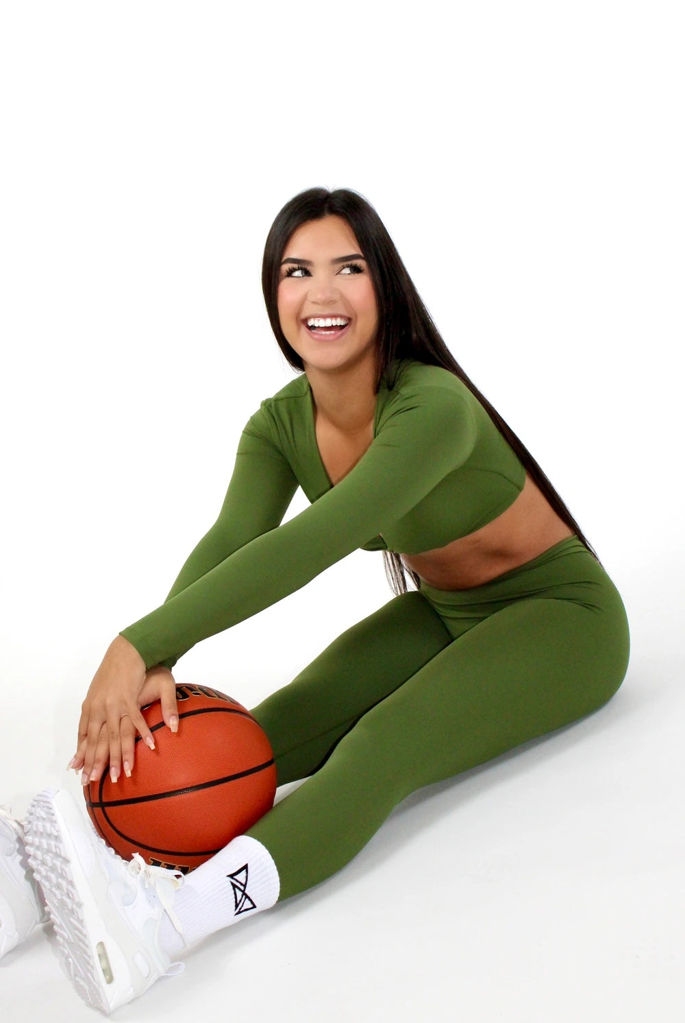 MILA MVMTSportswear Leggings V-Back Sexy Athleisure Fern Green Side - Sitting on the floor