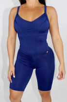 woman wearing navy blue sports corset romper from mila mvmt sportswear