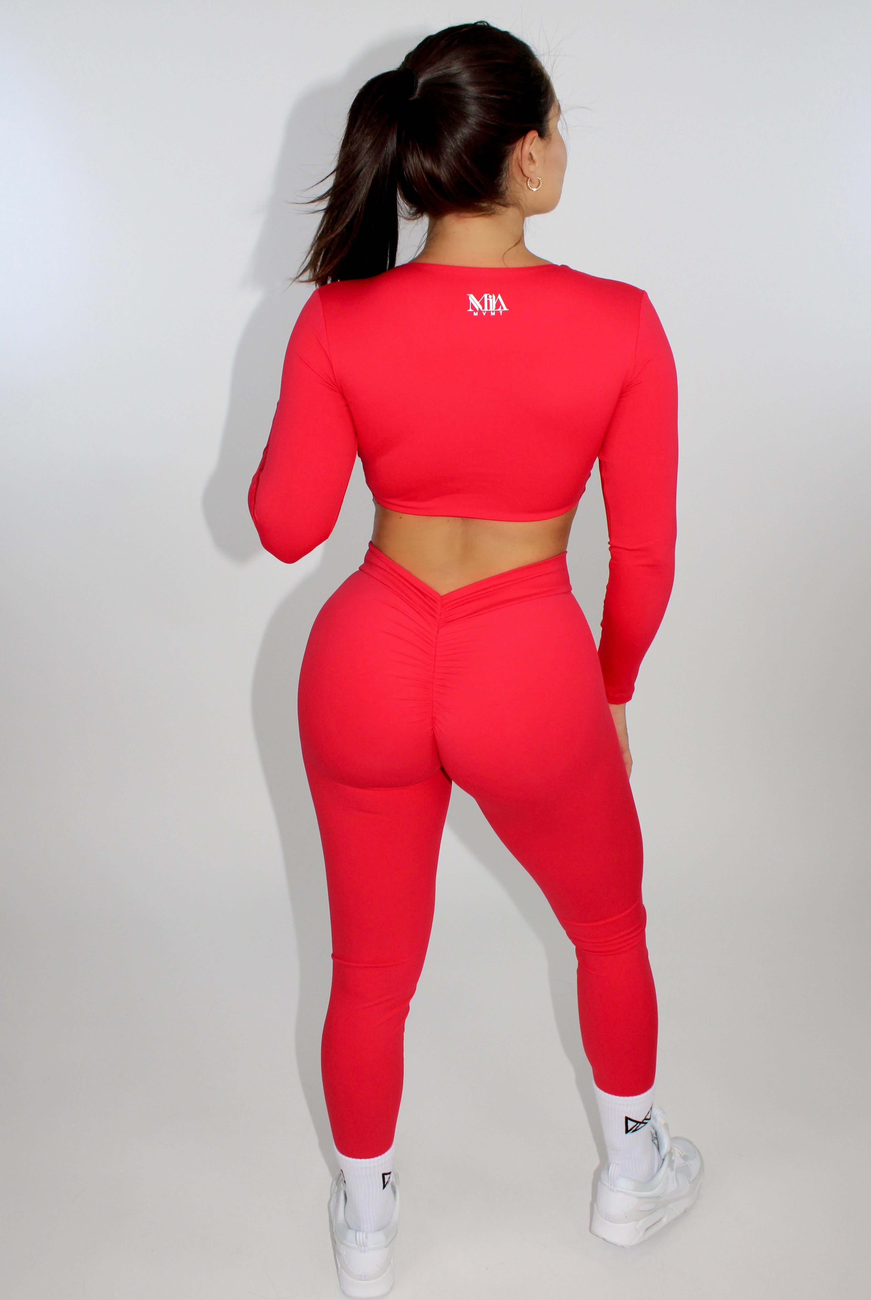 MILA MVMT Sportswear Long Sleeve Crop Top Gymwear Athleisure Sports Bra in Scarlet Red - model facing back