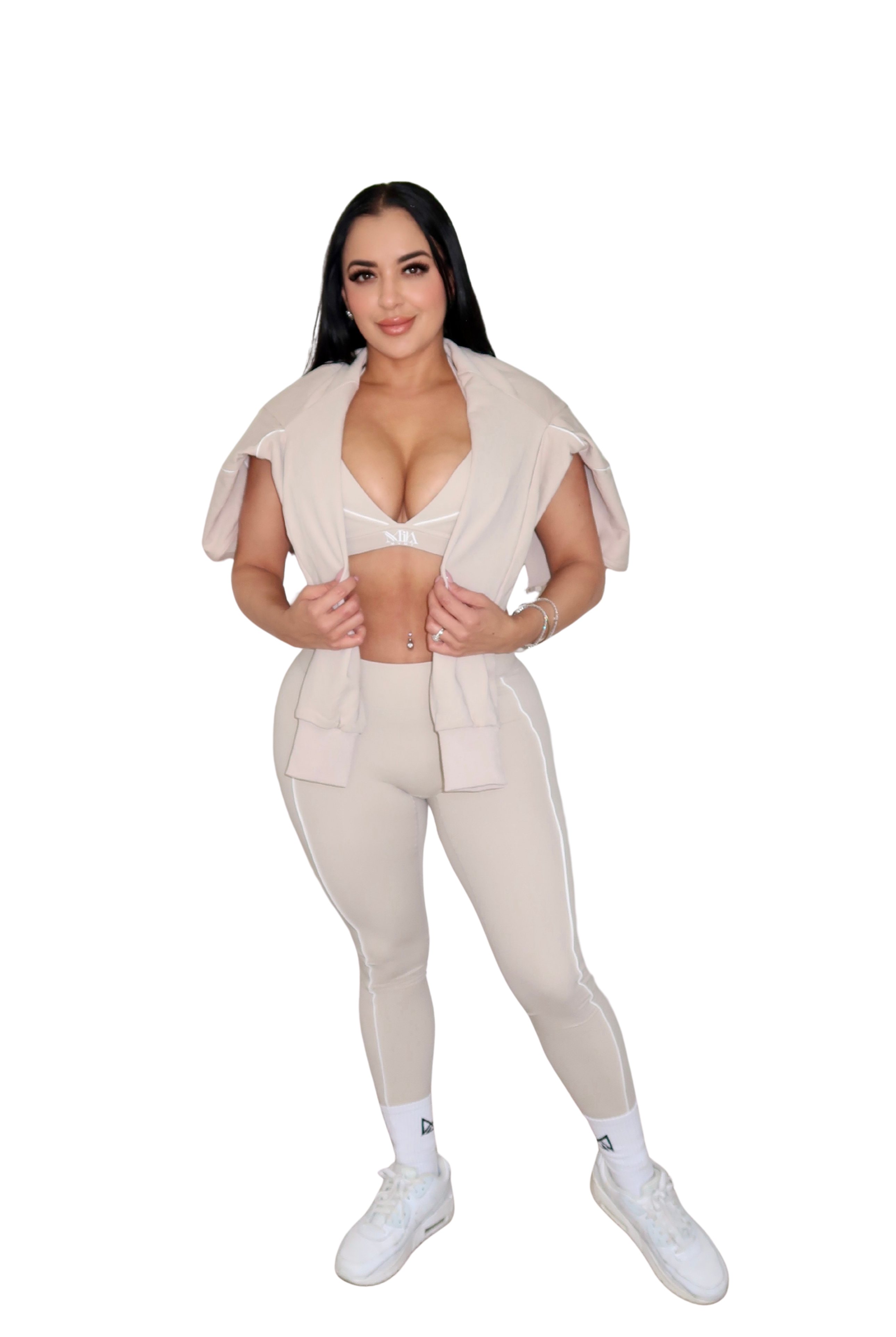 Woman wearing a beige outfit on a white background