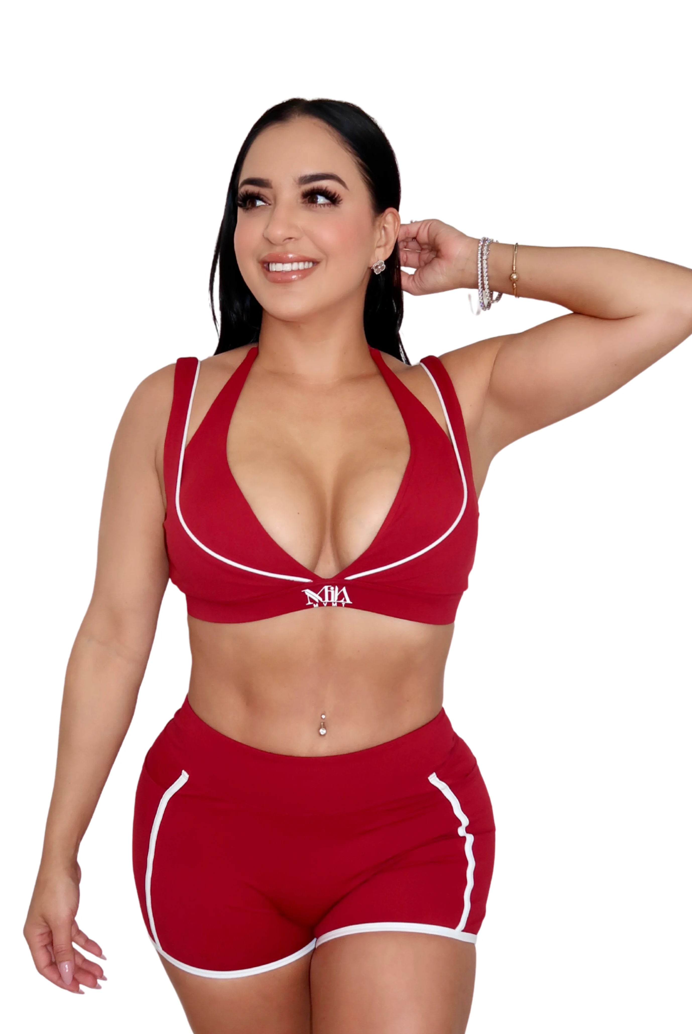 Woman wearing red activewear set for pilates and gym workout