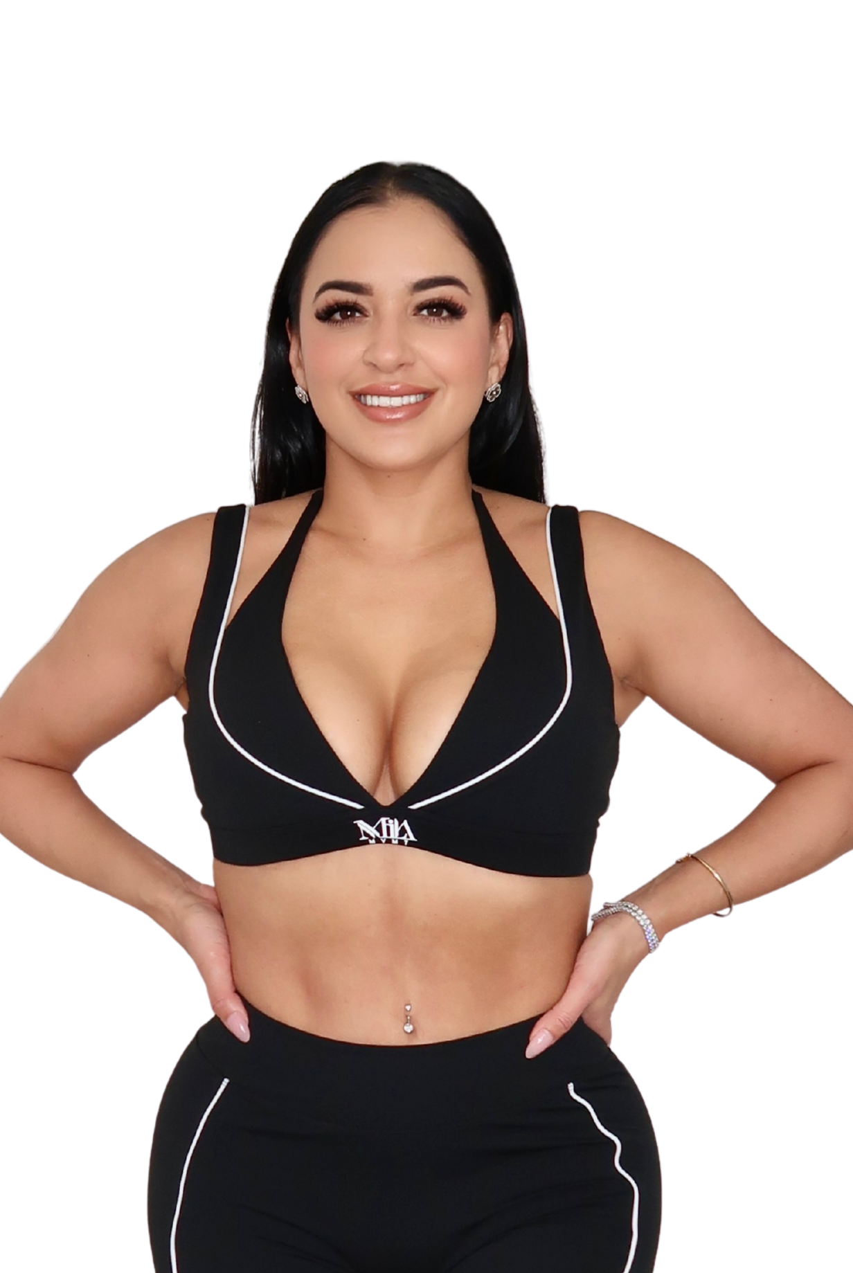 Woman wearing a black sports bra and leggings on a white background