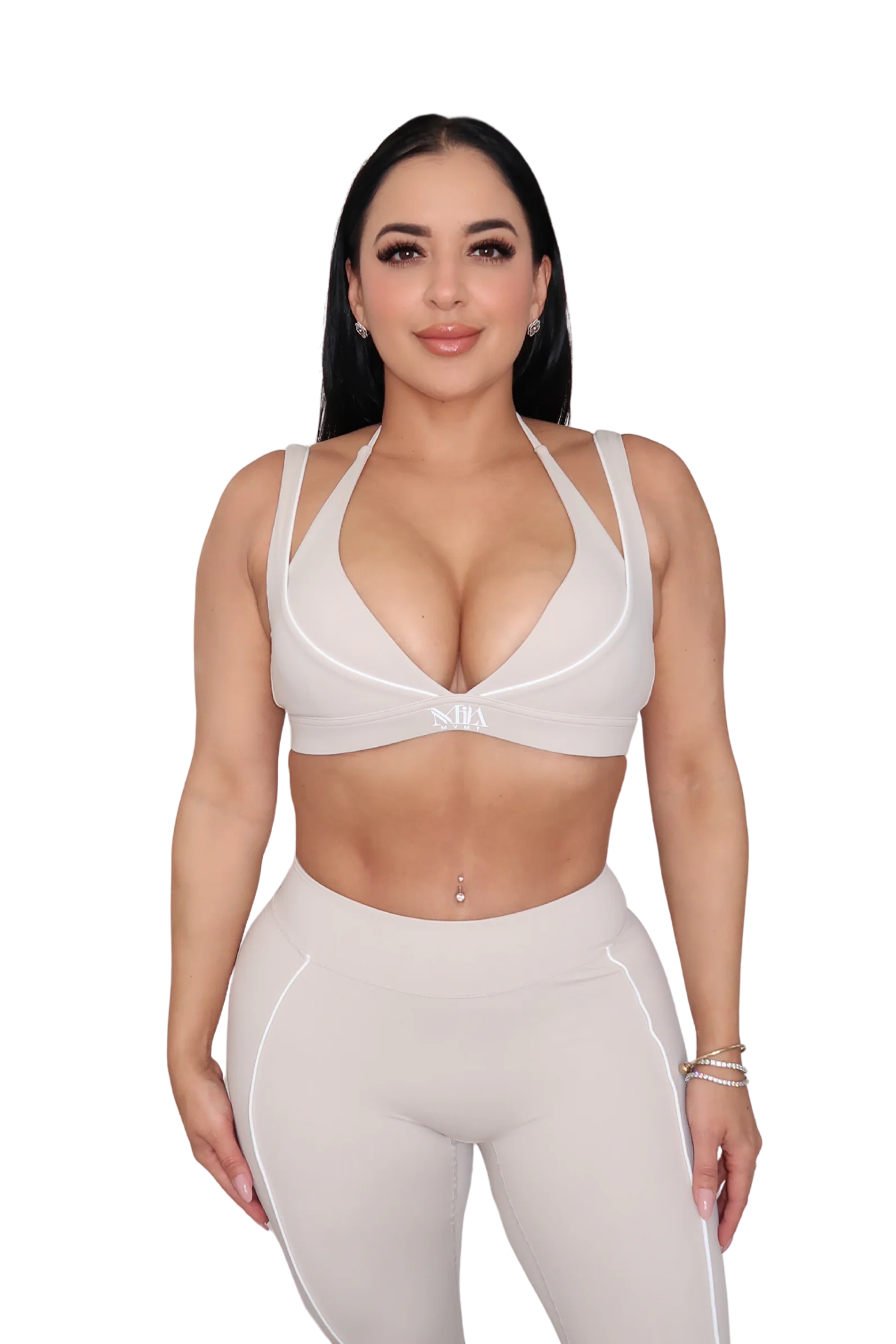 Woman in a beige athletic outfit 