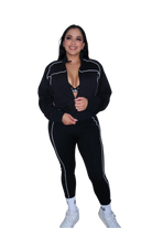 Front view of woman wearing a full black hoodie