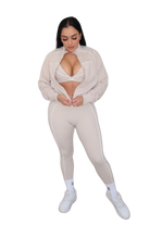 Full body view of woman wearing a beige jacket