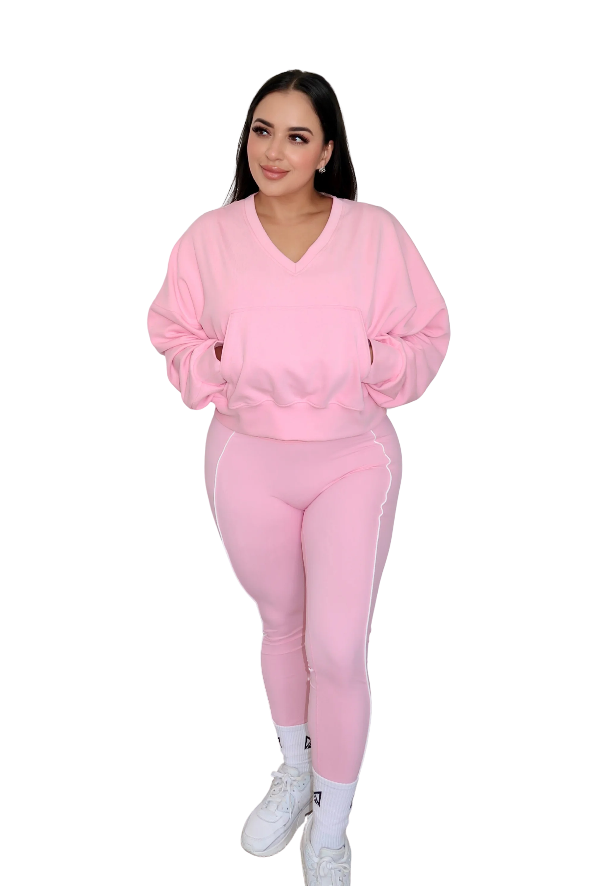 Full body front view of woman wearing petal pink jacket by MILA MVMT