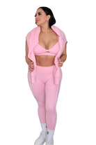 Front view of woman in petal pink leggings with jacket draped over shoulders by MILA MVMT