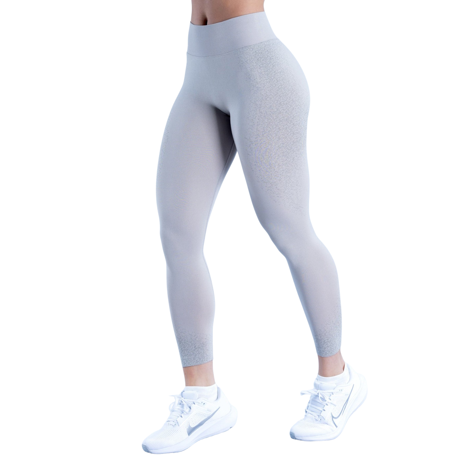 Gray leggings worn by a person on a white background
