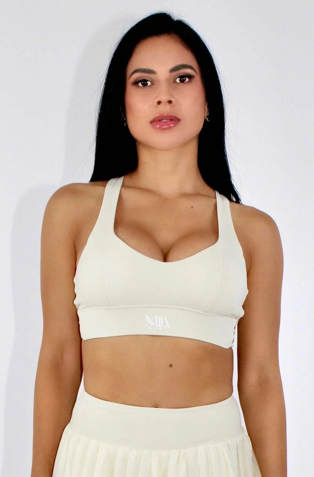 MILA MVMT Sportswear Cora Racerback Sports Bra in Cream - front facing view