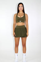 MILA MVMT Sportswear Ivy Pleated Tennis Skirt in Olive - Front Facing