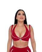 Woman wearing red activewear set for gym and pilates workout