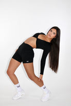 MILA MVMT Sportswear Gym Wear Workout Athleisure Crop Top Long Sleeve Black facing back touching leg